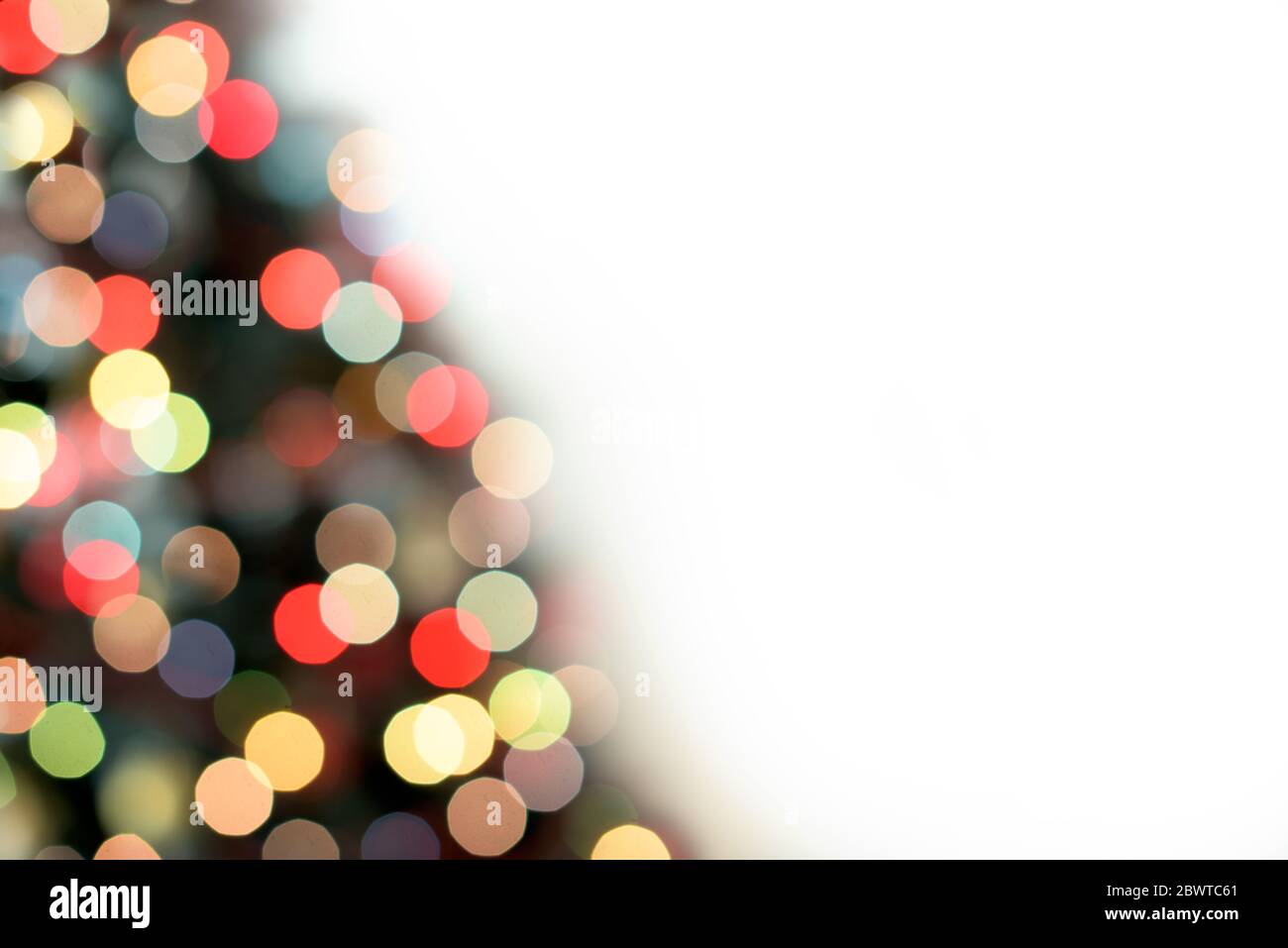 Part of blur Christmas tree lights decoration on white background Stock Photo