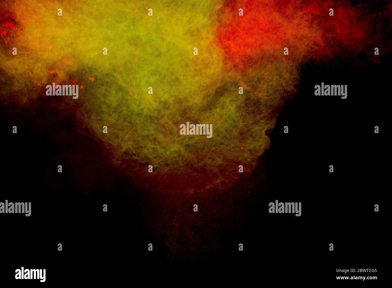Abstract colored dust explosion on a black background.abstract powder ...