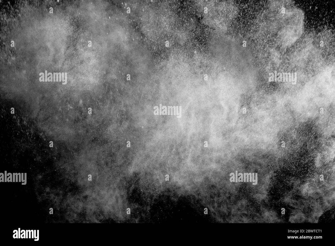 Abstract colored dust explosion on a black background.abstract powder ...