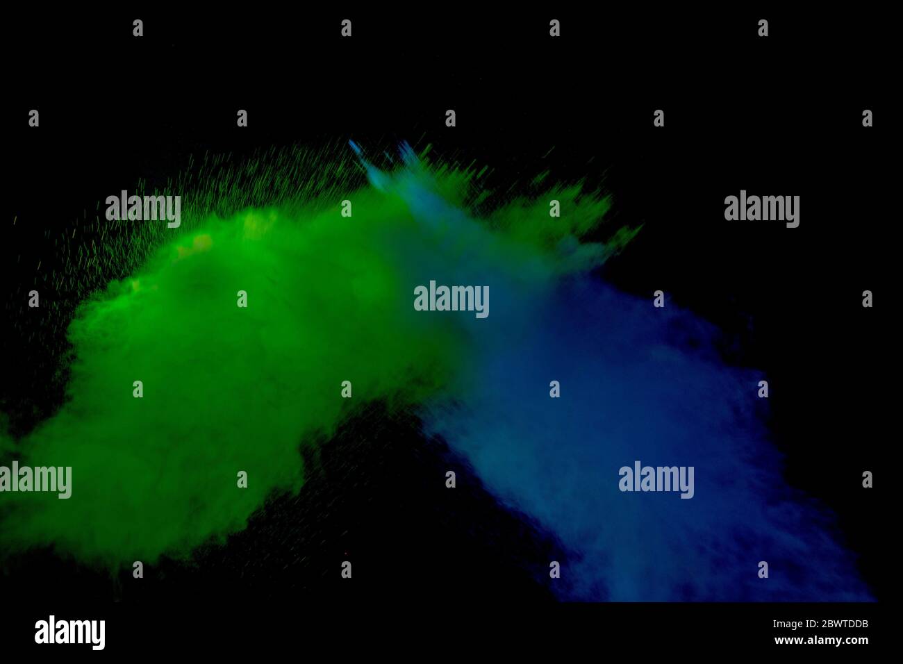 Abstract colored dust explosion on a black background.abstract powder ...