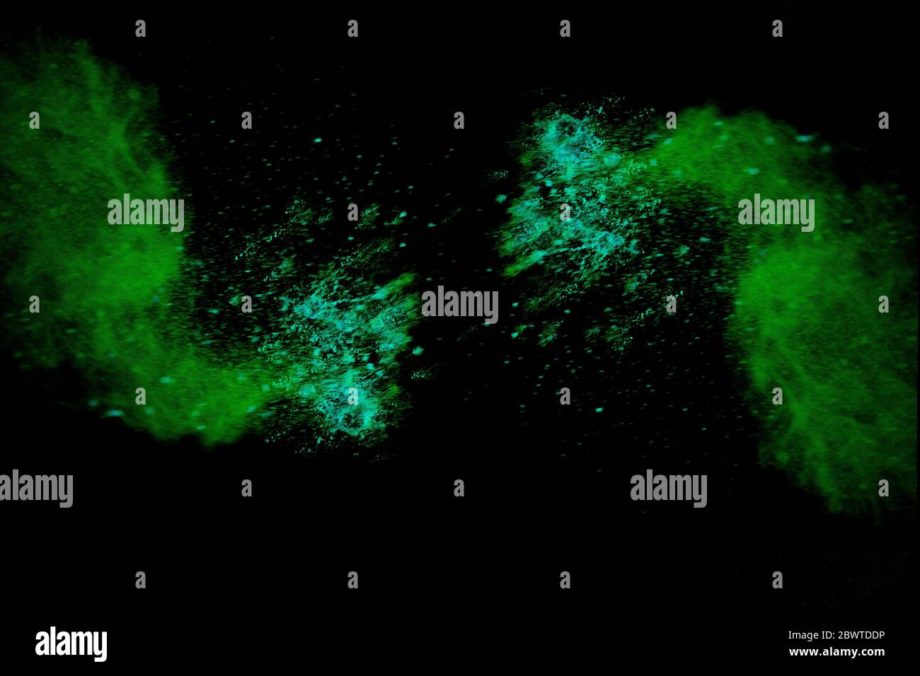 Abstract colored dust explosion on a black background.abstract powder ...