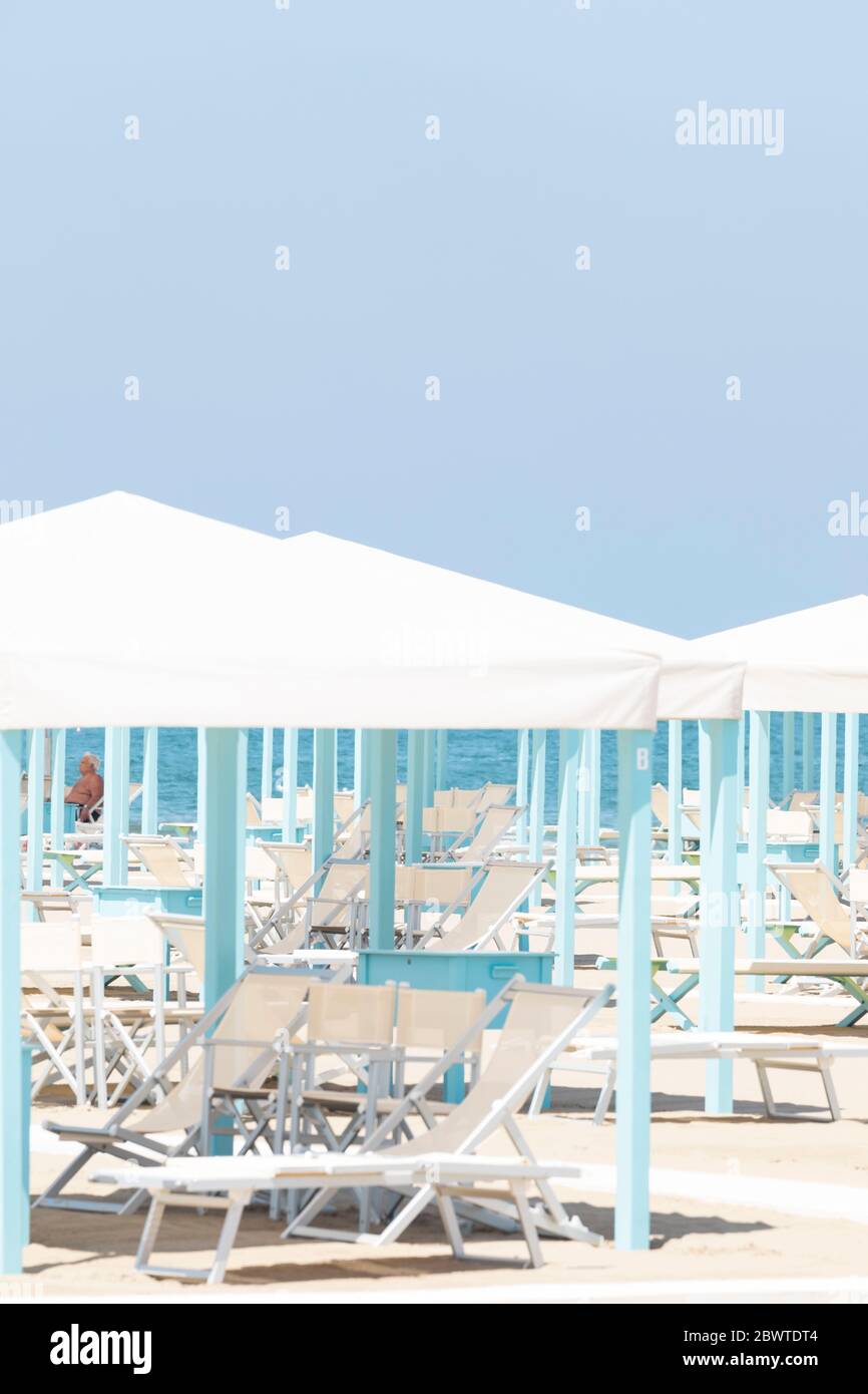 Pale blue poles, canopies and sunloungers on the Lido at Viareggio, Tuscany, Italy. Stock Photo