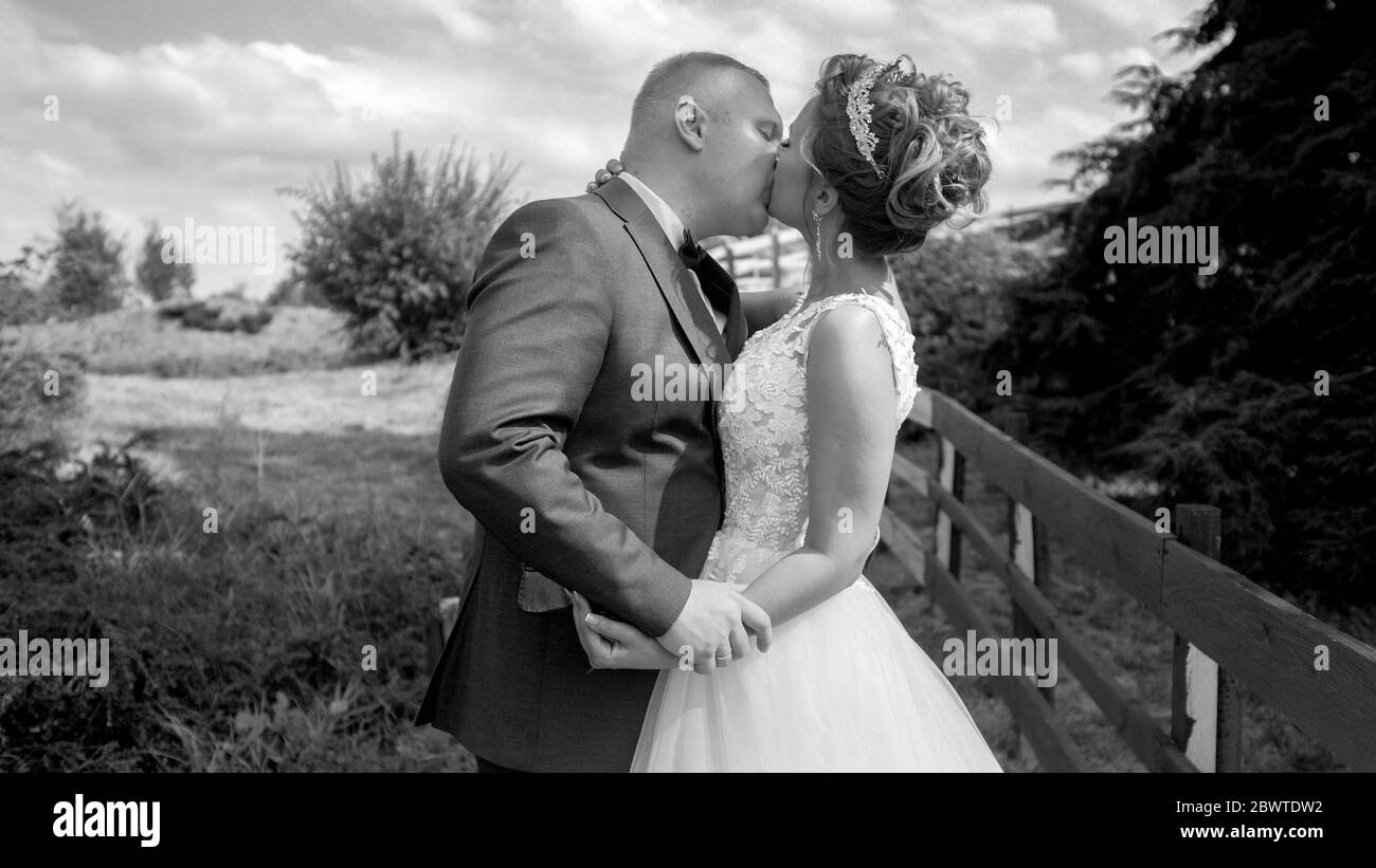 Black couple embrace holding Black and White Stock Photos & Images - Alamy