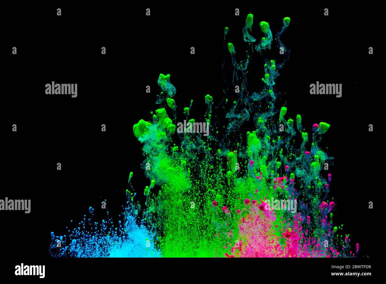 Abstract colored dust explosion on a black background.abstract powder ...