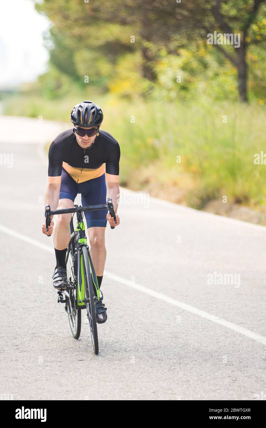 Professional road bike rider in action Stock Photo