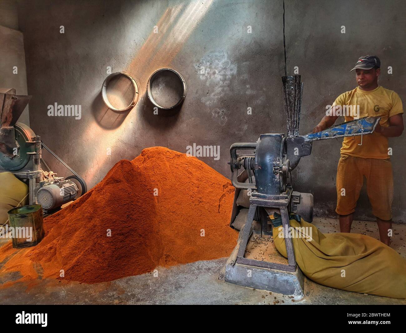 Kathmandu, Nepal. 3rd June, 2020. A man prepares turmeric powder at a mill during nationwide lockdown amid COVID-19 outbreak in Kathmandu, capital of Nepal on June 3, 2020. Credit: Sunil Sharma/ZUMA Wire/Alamy Live News Stock Photo