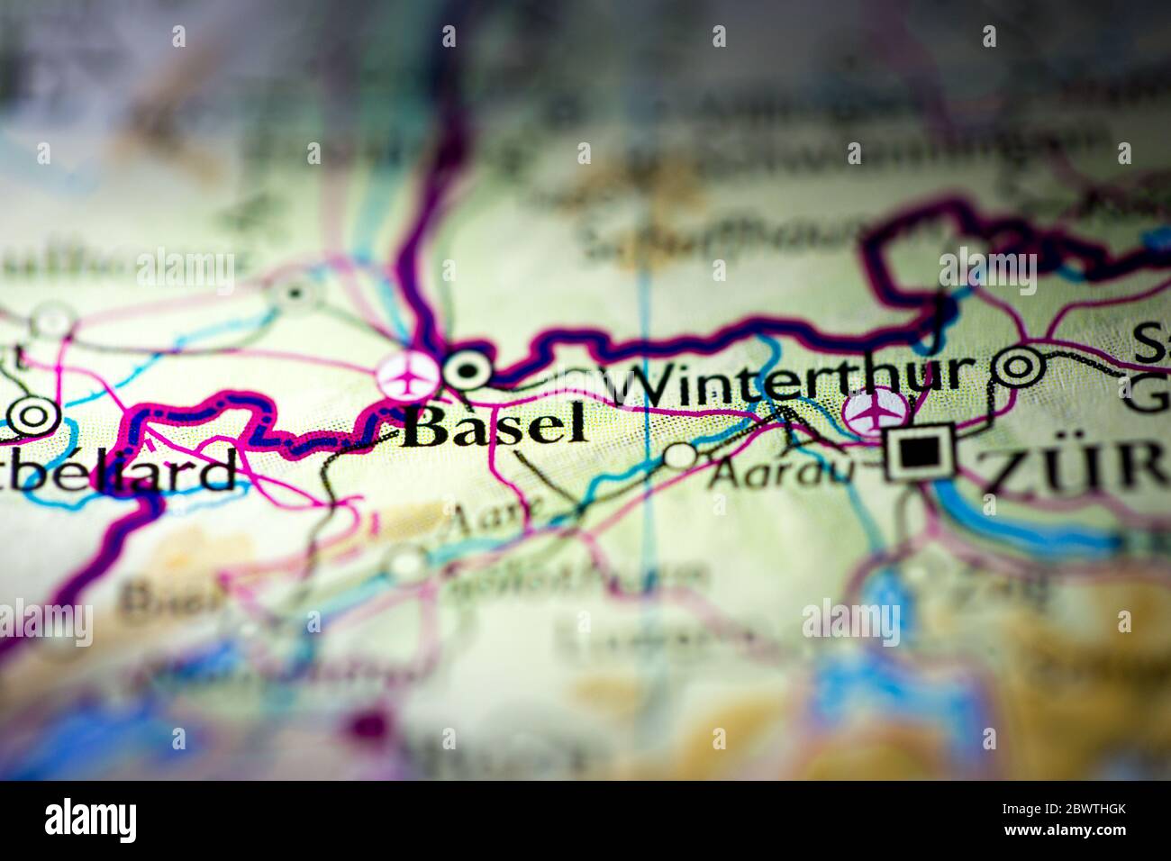 Shallow depth of field focus on geographical map location of Basel city Switzerland Europe continent on atlas Stock Photo