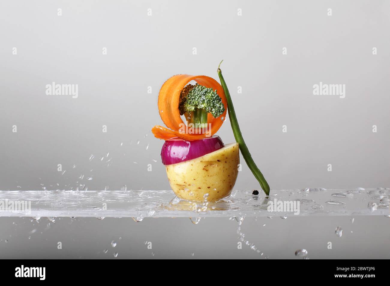 Fresh vegetables in water splash. Healthy food. Slim diet. Ingredients