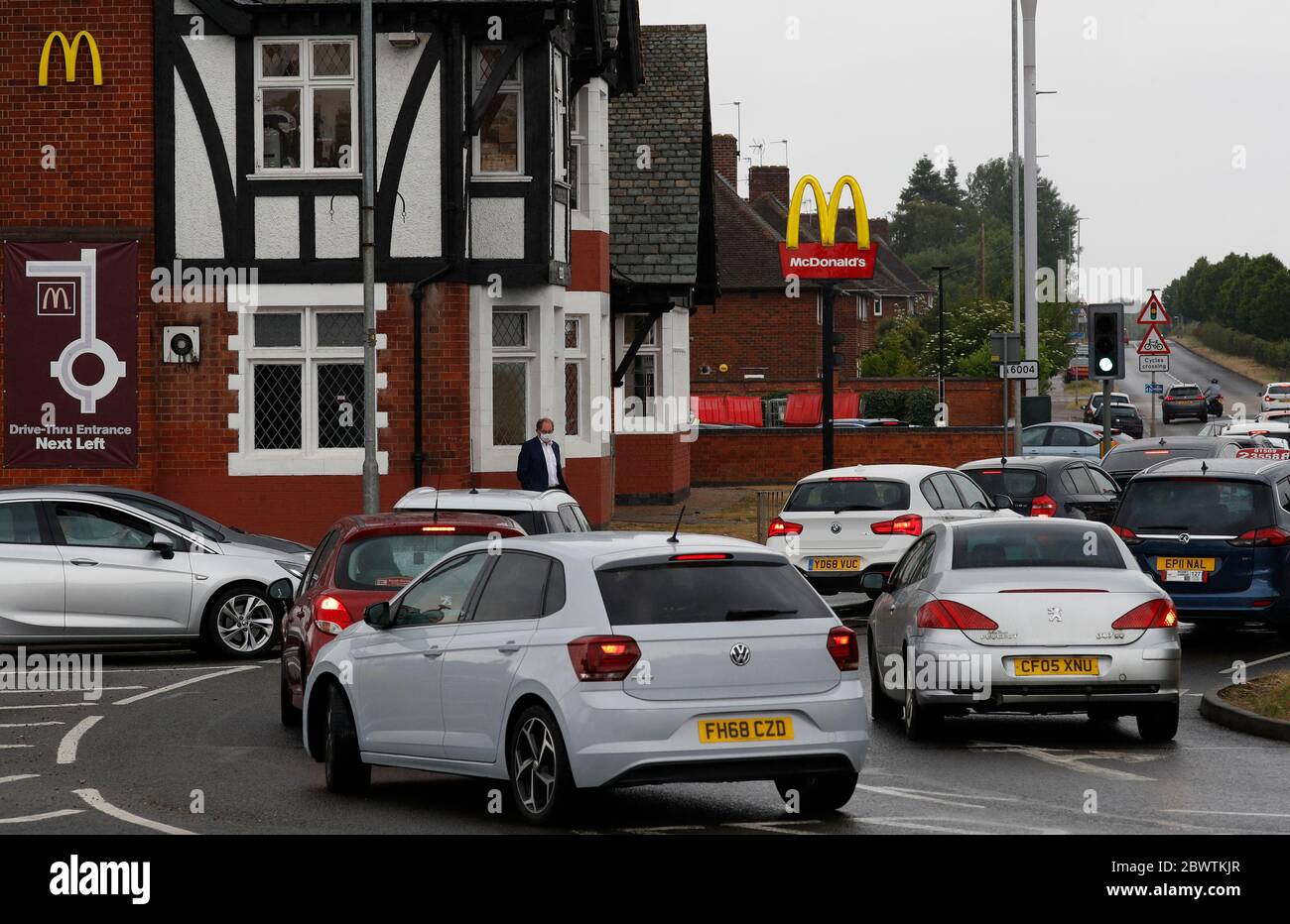 Loughborough, Leicestershire, UK. 3rd June 2020. A queue of cars forms at a McDonaldÕs drive-through restaurant that has reopened after coronavirus pandemic lockdown restrictions were eased. Credit Darren Staples/Alamy Live News. Stock Photo