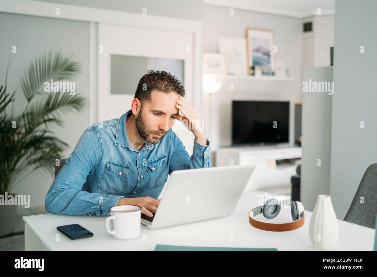 Mid adult man working from home during coronavirus pandemic outbreak, Almeria, Spain, Europe Stock Photo