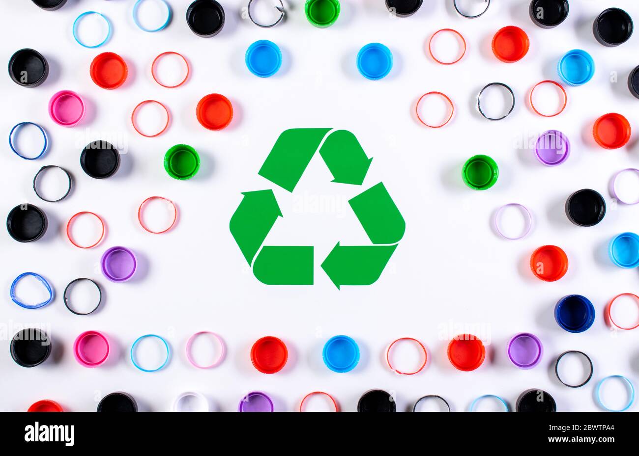 Colored plastic bottle caps with recycle symbol. World environment day