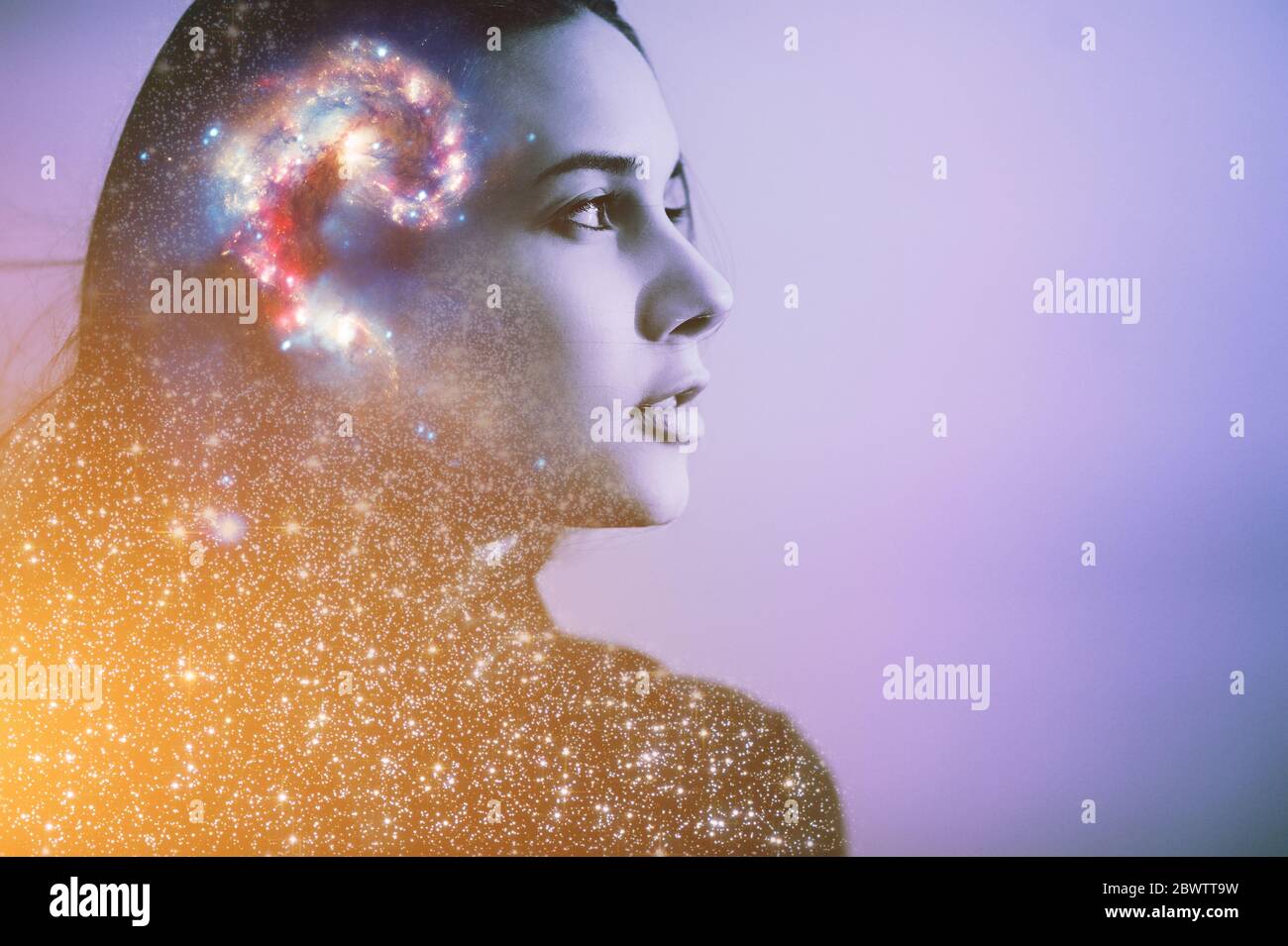 Double multiply exposure abstract portrait of a dreamy cute young woman face with galaxy universe space inside head. Human spirit, astronomy, life zen Stock Photo