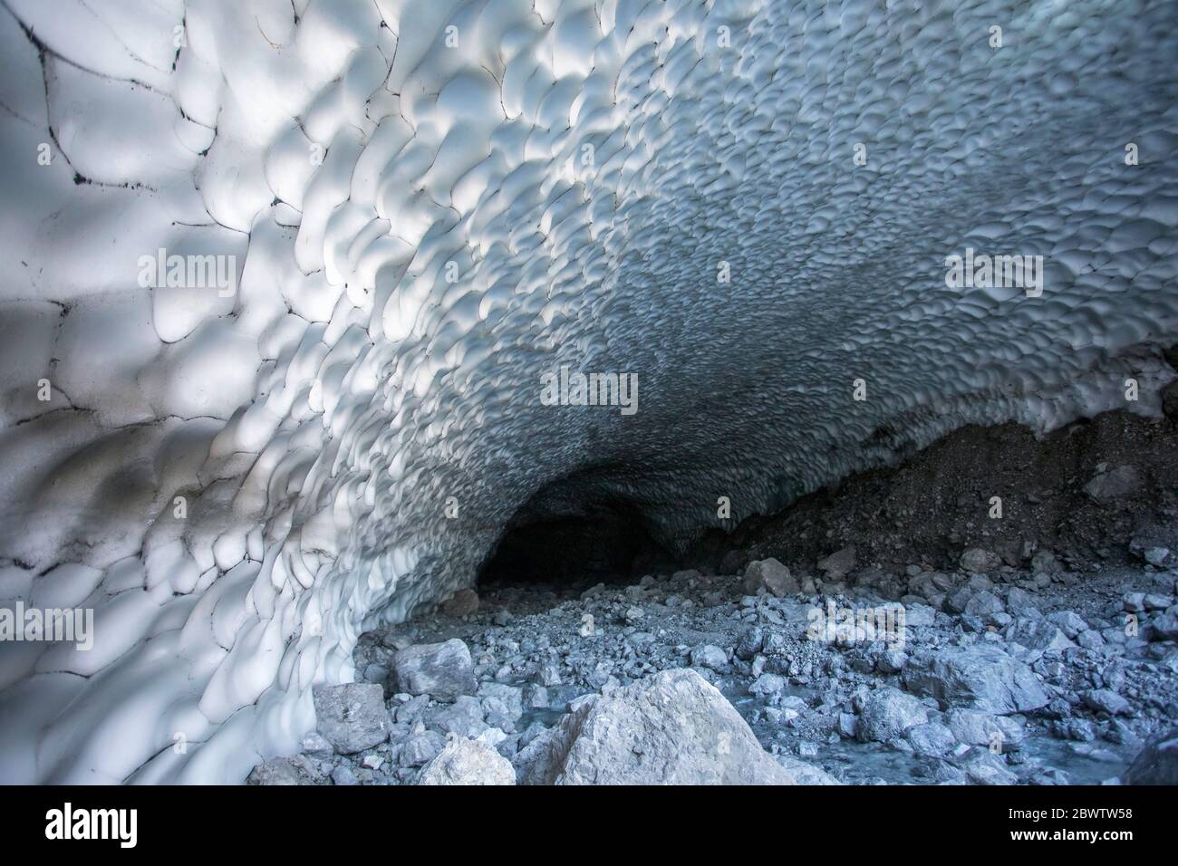 Germany, Bavaria, Berchtesgaden, Cave in Eiskapelle snowfield Stock Photo