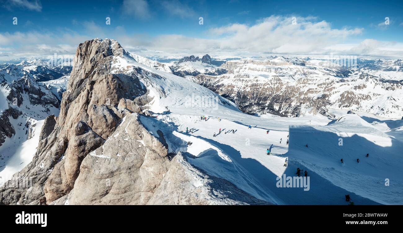Italy, Trentino, Skiers at summit of Marmolada mountain Stock Photo