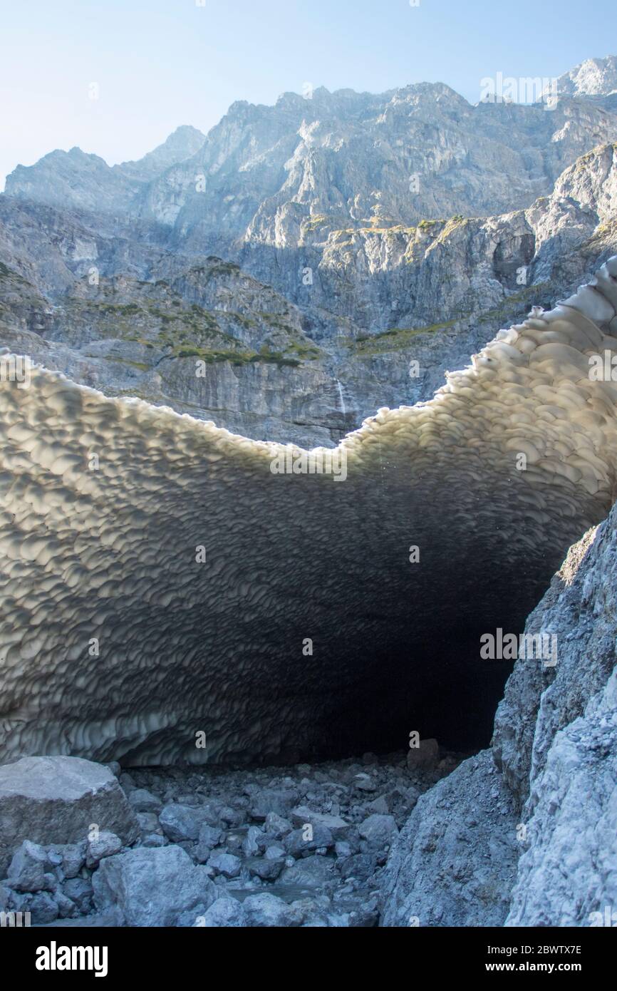 Germany, Bavaria, Berchtesgaden, Cave in Eiskapelle snowfield Stock Photo