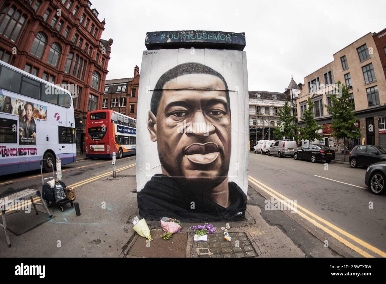3rd June 2020. Manchester, United Kingdm. Crowds gather in Stevenson Square as French street artist AKSE p19 completes a mural of George Floyd. The mural marks the death of Floyd, a black man, after he was pinned under the knee of a white police officer in Minneapolis for almost nine minutes. Credit: Howard Harrison/Alamy Live News Stock Photo