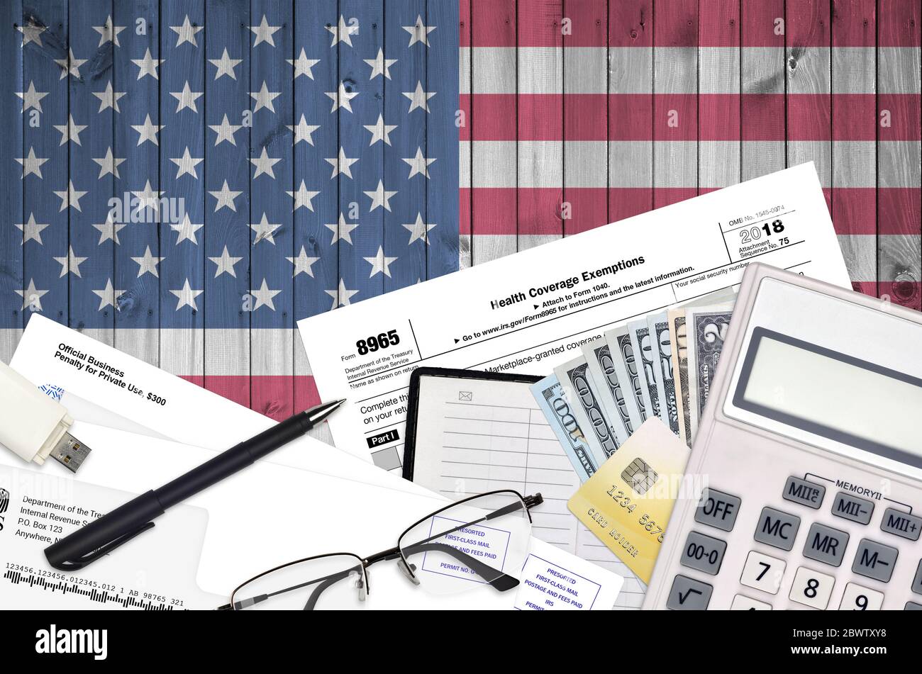 IRS form 8965 Health Coverage Exemptions lies on flat lay office table ...
