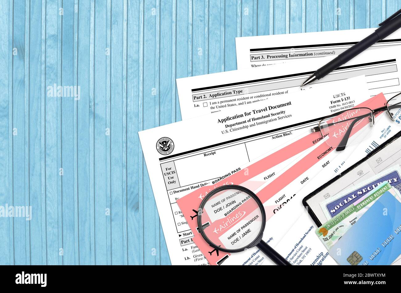 USCIS form I131 Application for travel document lies on flat lay office table and ready to fill
