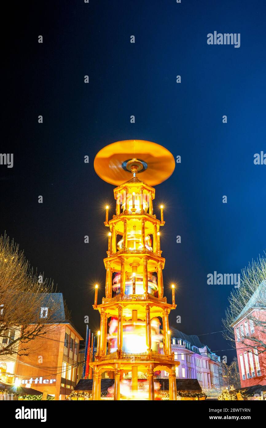 Germany, Rhineland-Palatinate, Mainz, Christmas pyramid glowing ta market square at night Stock Photo