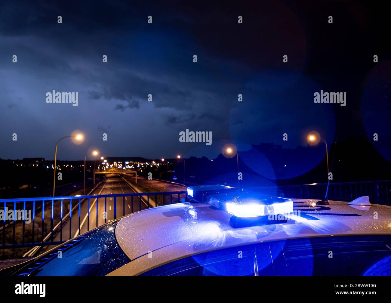 Spain, Madrid, Close-up of police emergency lights glowing during night intervention Stock Photo