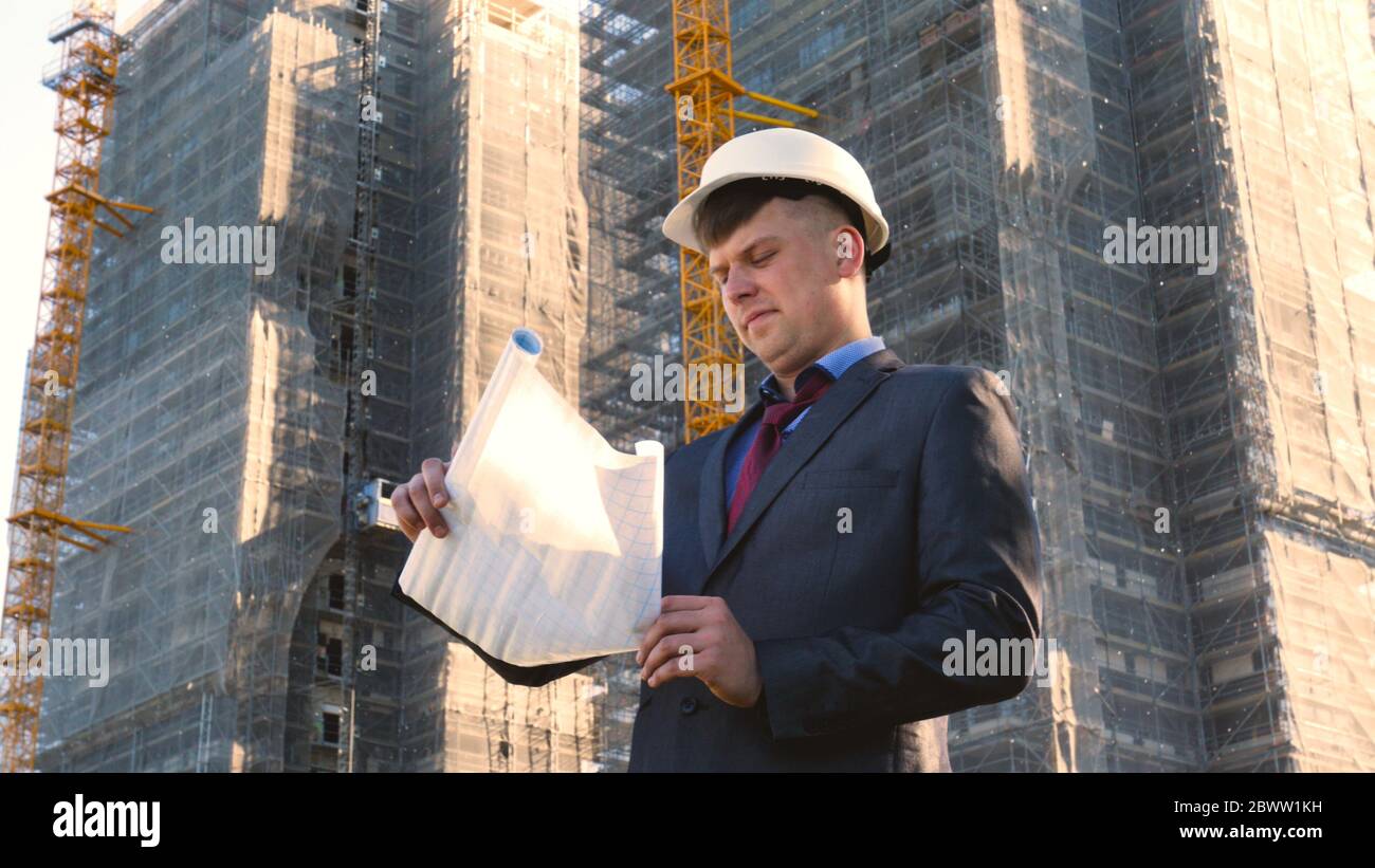 Portrait of a successful young handsome engineer, architect, builder ...