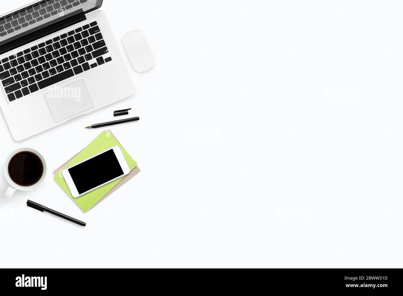 white office desk table with laptop, and supplies. Top view with copy