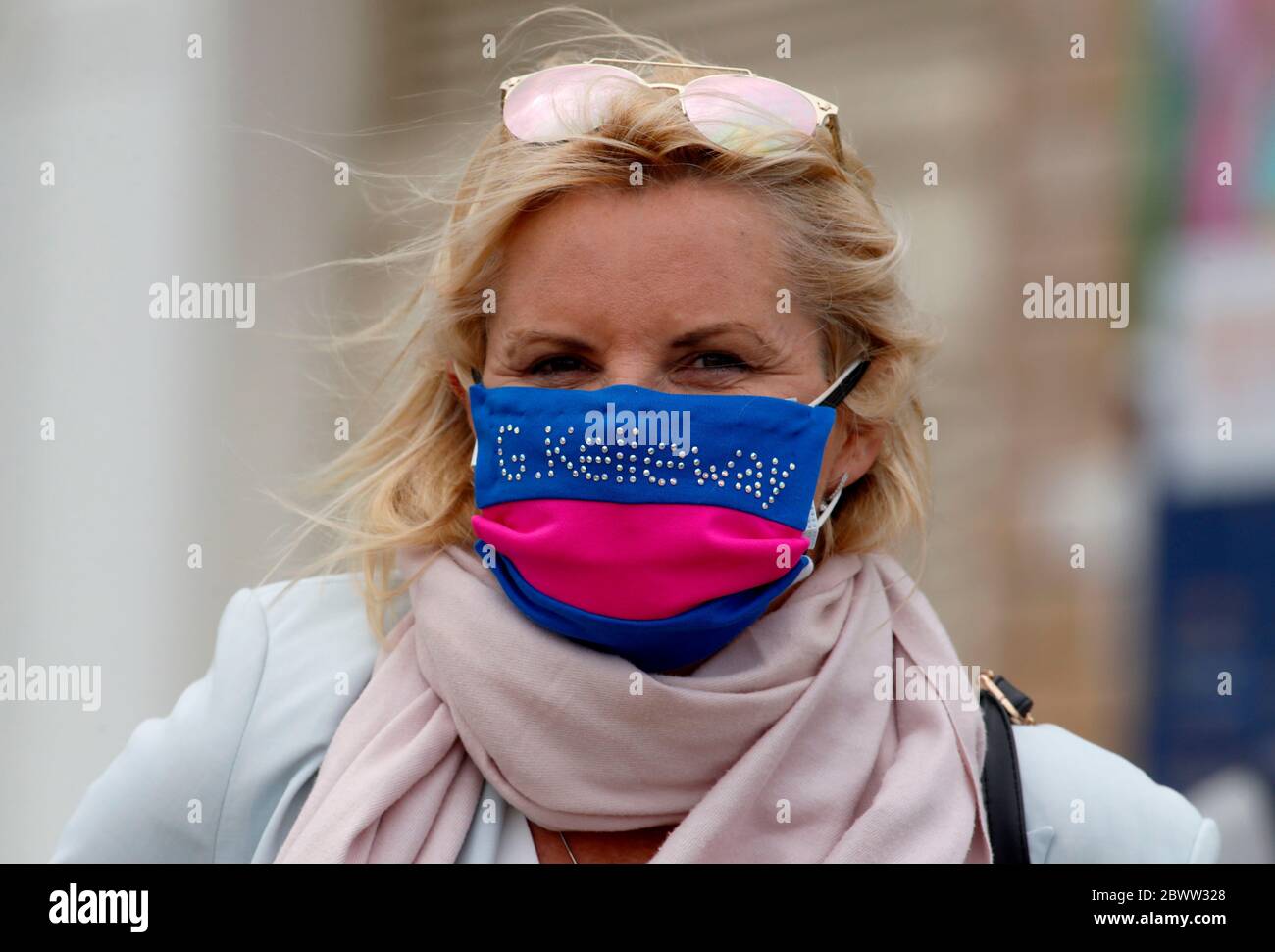 Guess Who trainer Gay Kelleway with her racing colours face mask at Yarmouth Racecourse. Stock Photo