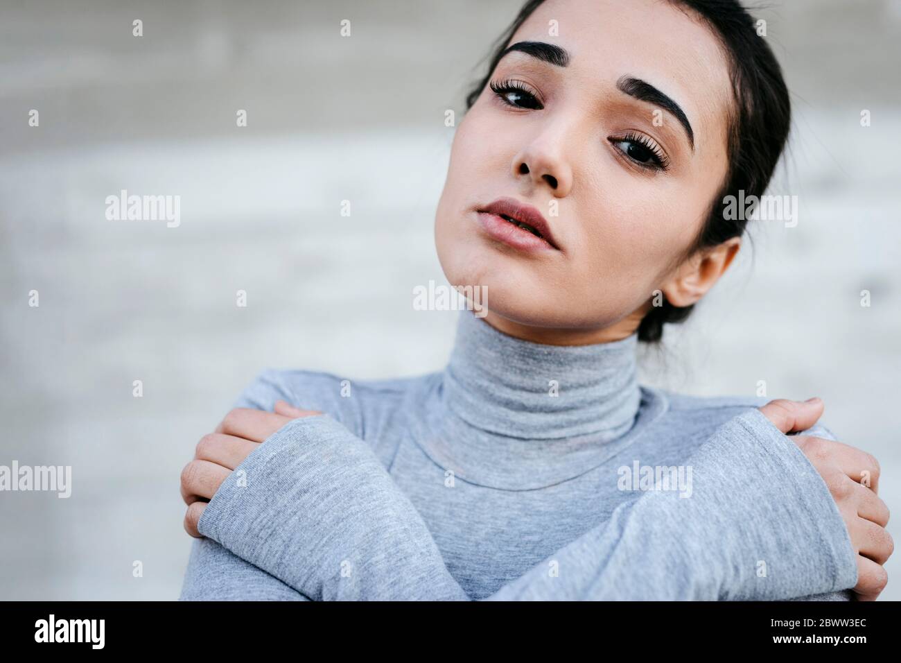 Portrait of young woman with black hair Stock Photo