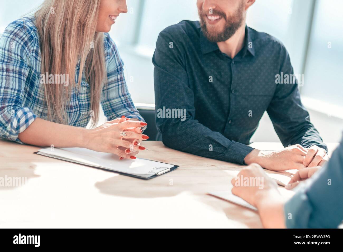 group of business people sitting at the office table Stock Photo - Alamy