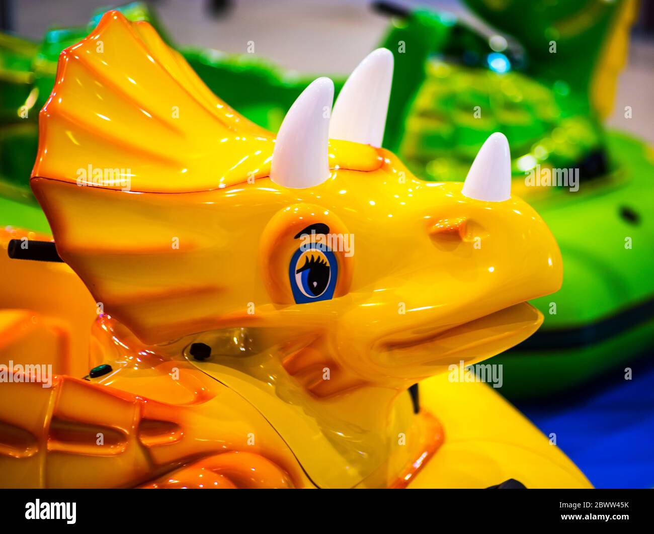 Plastic Mannequin Blue eyed Toy Dinosaur In A Children s Park Stock