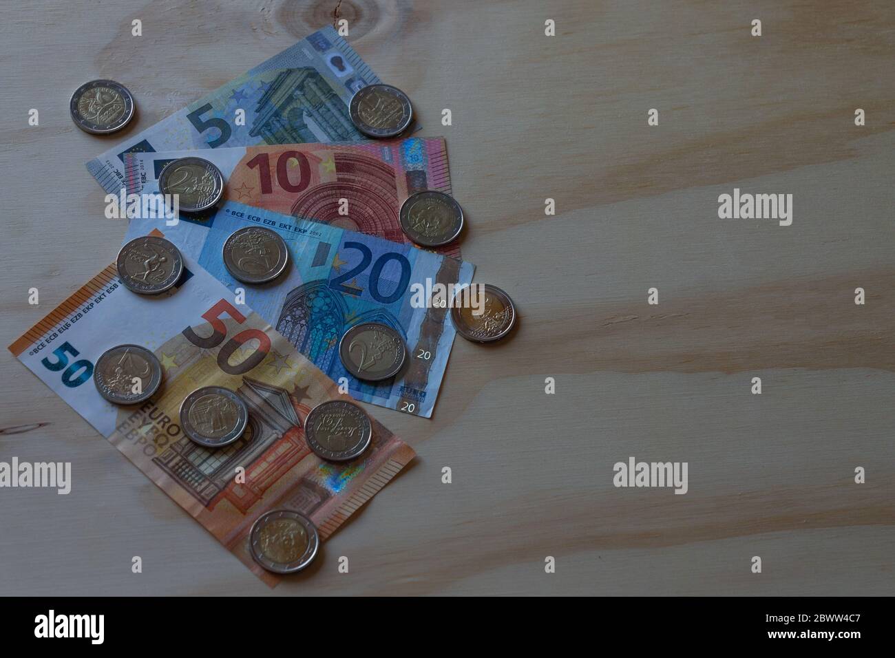 Euro Money banknotes and coins on a table Stock Photo