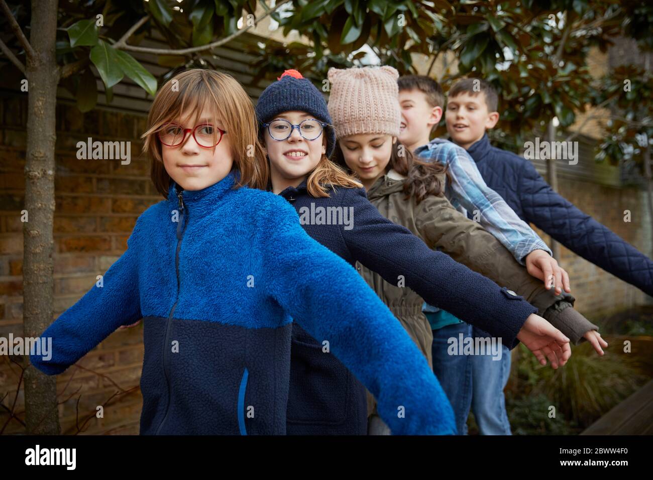 Group of children on the schoolyard during break time Stock Photo