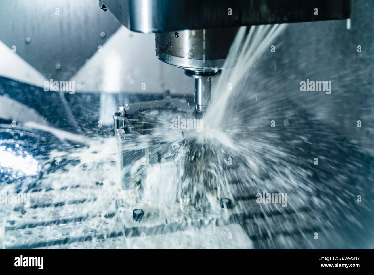 Germany, Close-up of water cooling down milling cutter Stock Photo