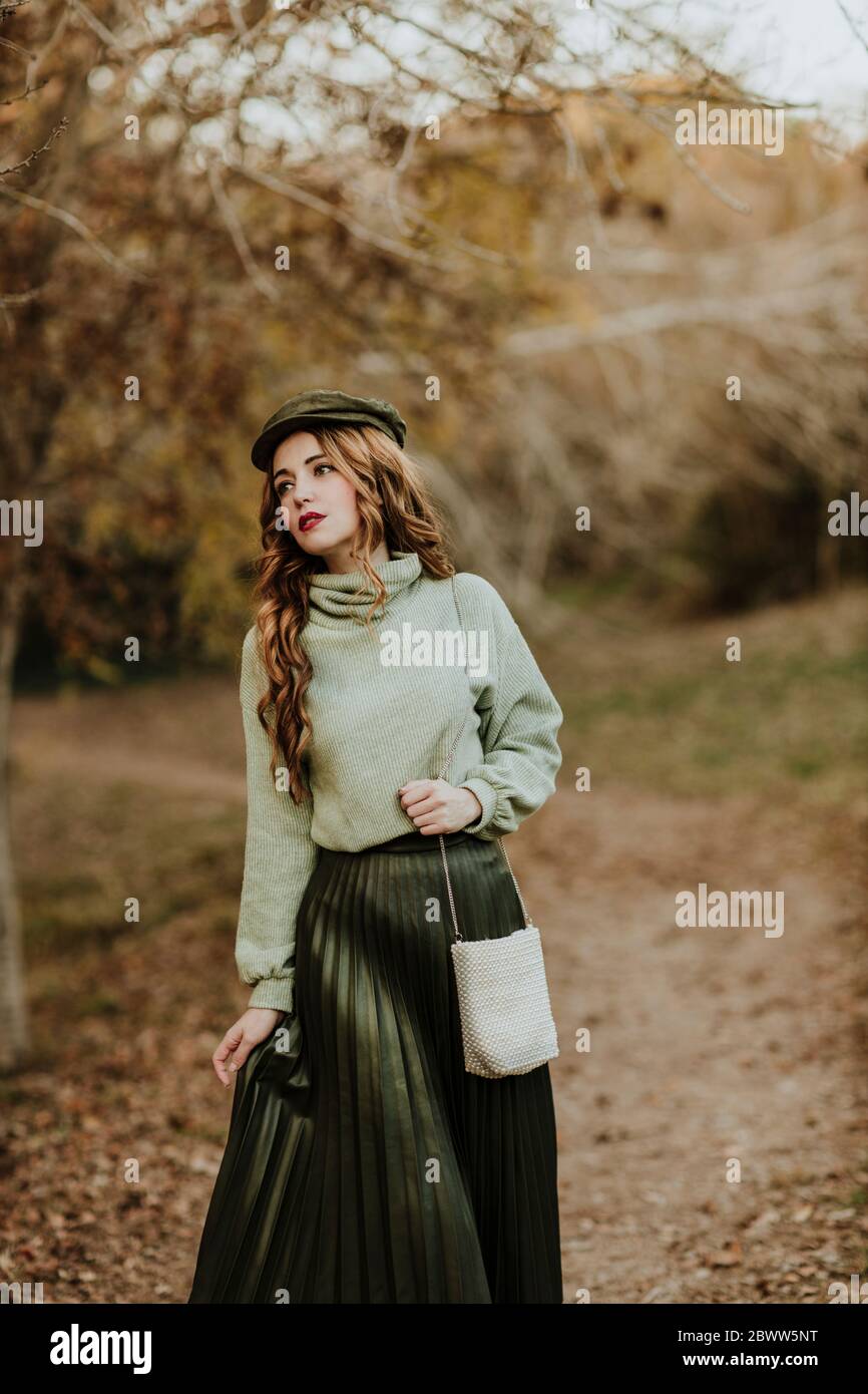 Portrait of fashionable woman in autumnal nature Stock Photo
