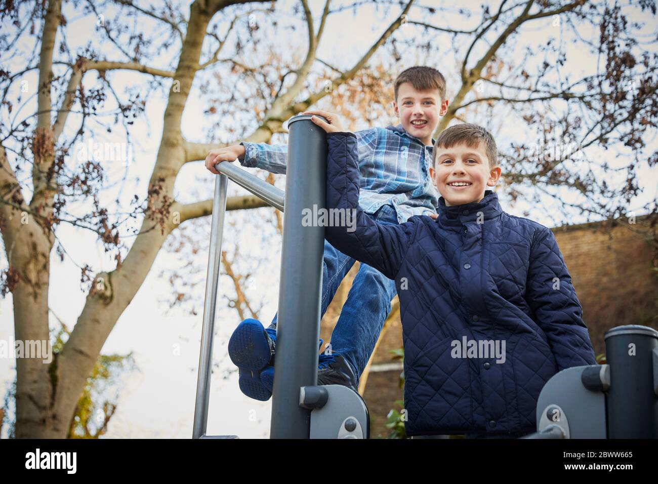 Two happy boys on the schoolyard playground during break time Stock Photo