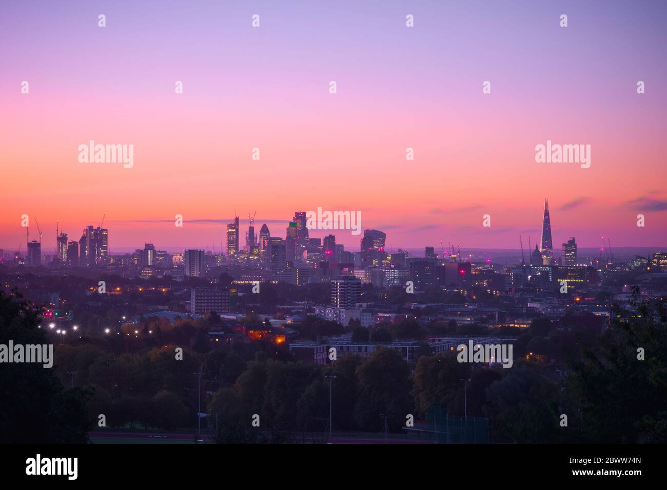 View towards London city skyline at sunrise from Parliament Hill in