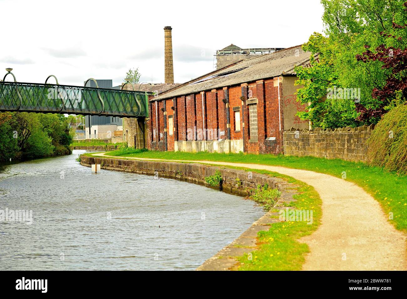 Old industrial buildings on the banks of the Leeds Liverpool canal at Burnley Stock Photo