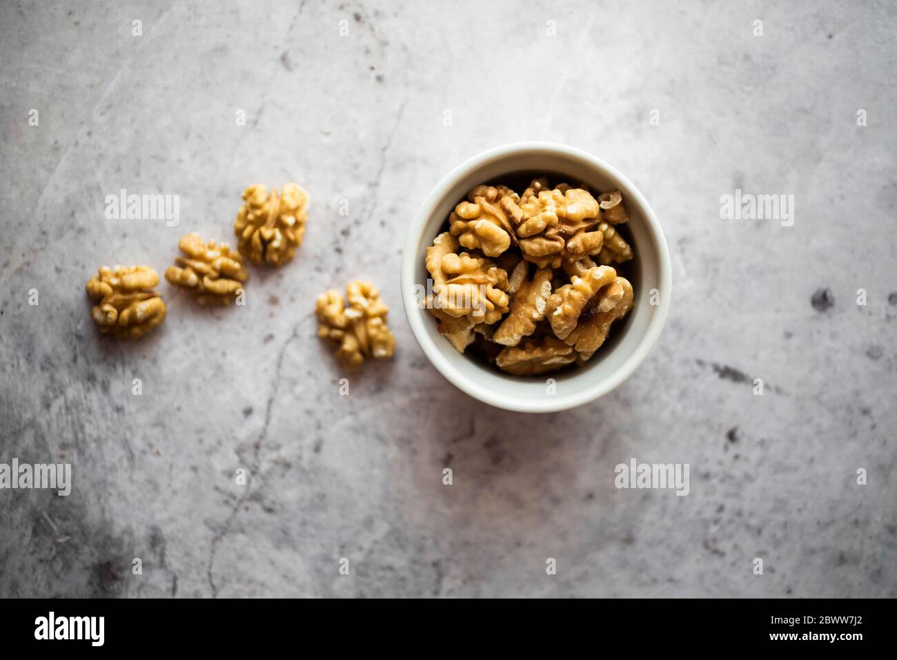 Bowl of peeled walnuts Stock Photo