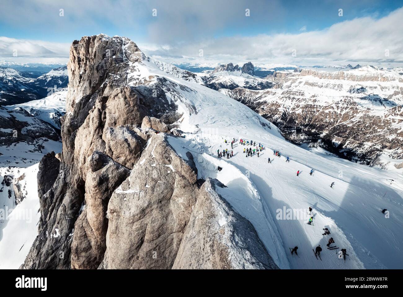 Italy, Trentino, Skiers at summit of Marmolada mountain Stock Photo