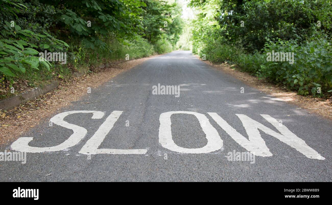 Slow road marking hi-res stock photography and images - Alamy