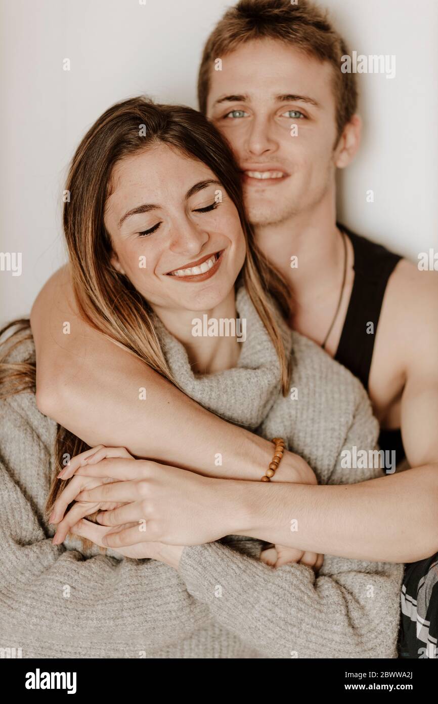 Portrait of happy young couple at home Stock Photo