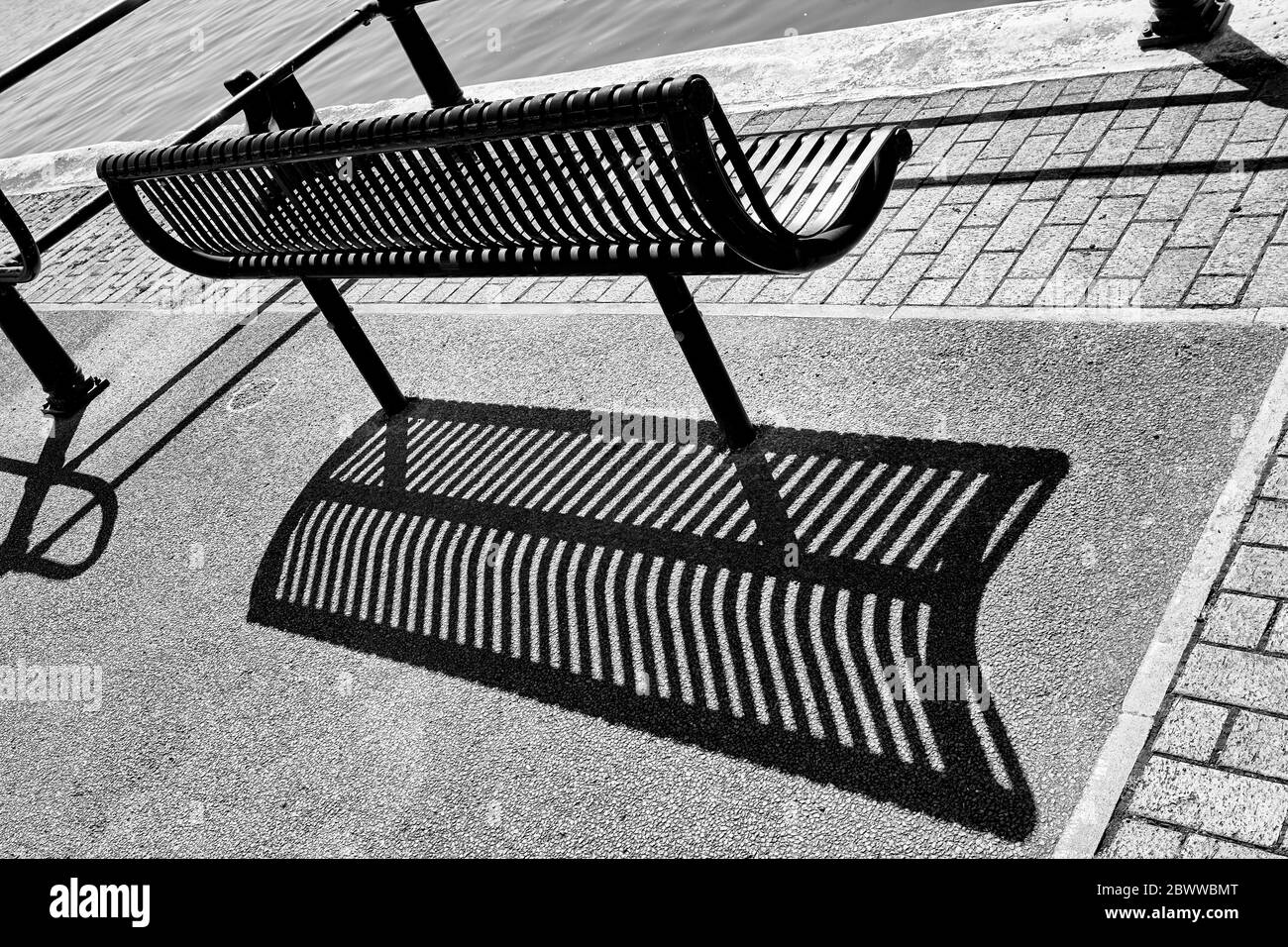 A Metal Bench by the River Avon in Bristol, England UK Stock Photo