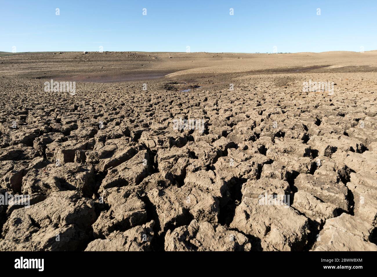 Low Water Levels at Selset Reservoir after the driest May on record, coupled with repair work downstream left the Ground Parched and Cracked, Lunedale Stock Photo