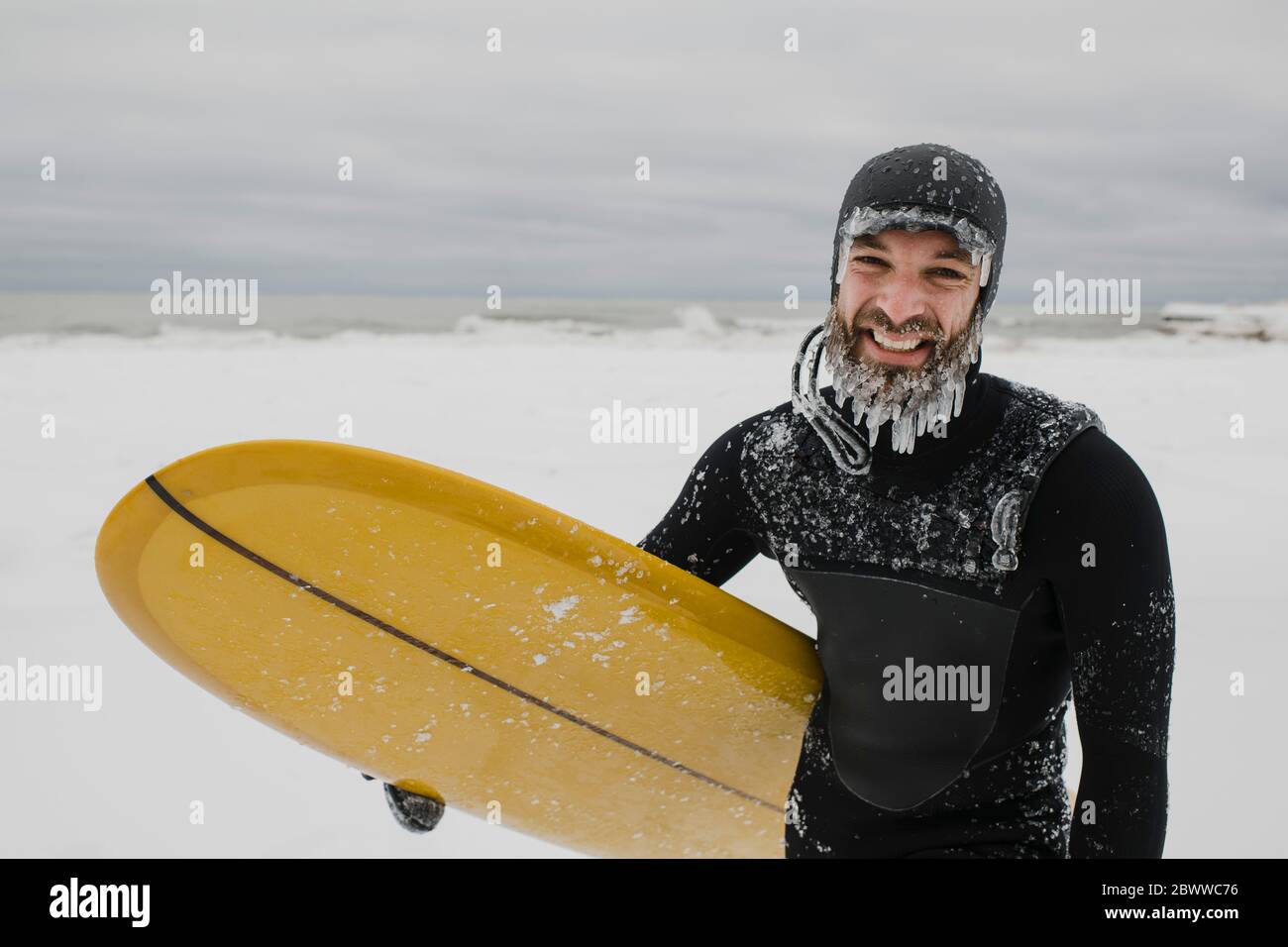 Surfer with surfboard in snow in Ontario, Canada Stock Photo Alamy
