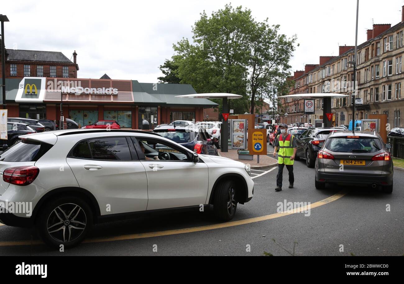 Cars are directed at McDonald's drive through in Pollokshaws, Glasgow as it was announced drive thrus are to re-open as Scotland is moving into phase one of the Scottish Government's plan for gradually lifting lockdown. Stock Photo