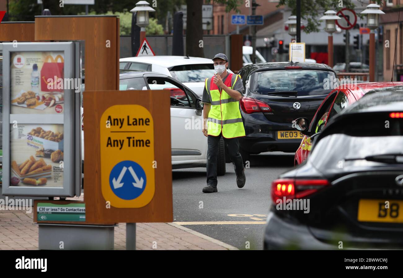 Cars are directed at McDonald's drive through in Pollokshaws, Glasgow as it was announced drive thrus are to re-open as Scotland is moving into phase one of the Scottish Government's plan for gradually lifting lockdown. Stock Photo