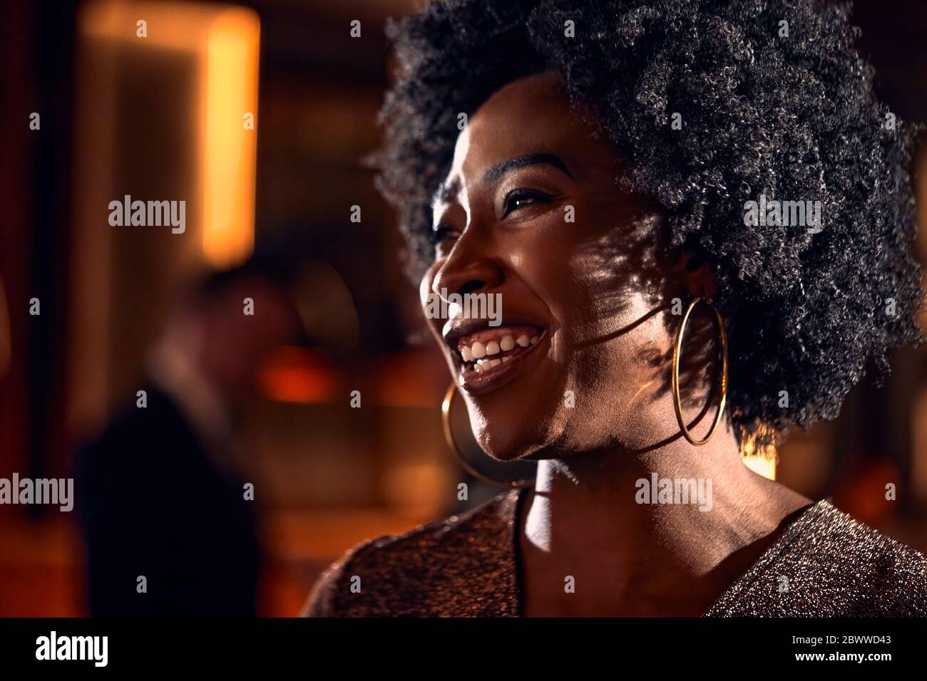 Portrait of a happy woman in a bar Stock Photo