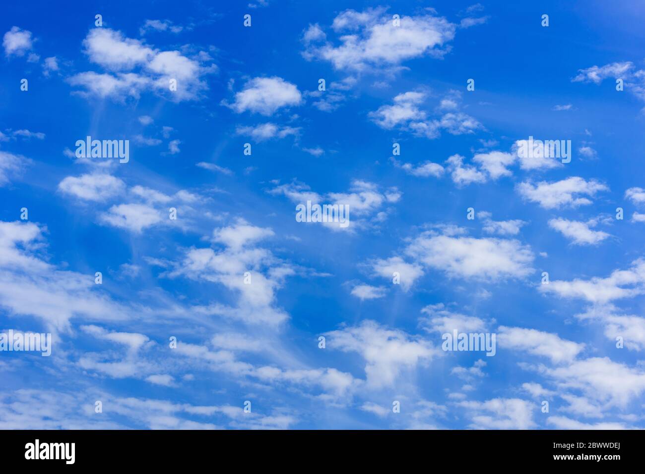 Altocumulus clouds in blue sky. Cloudlets Stock Photo