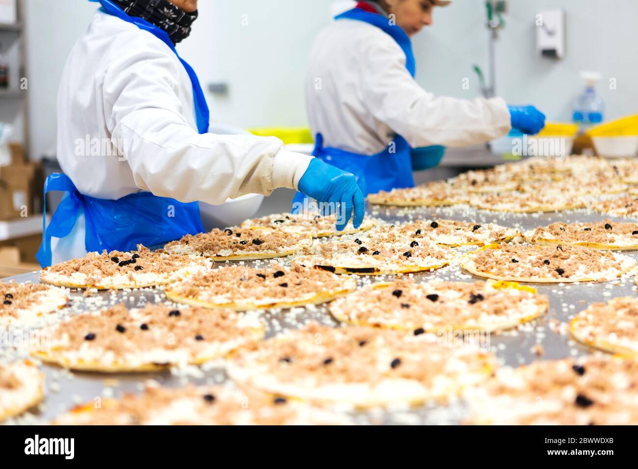 Two women working in pizza company Stock Photo