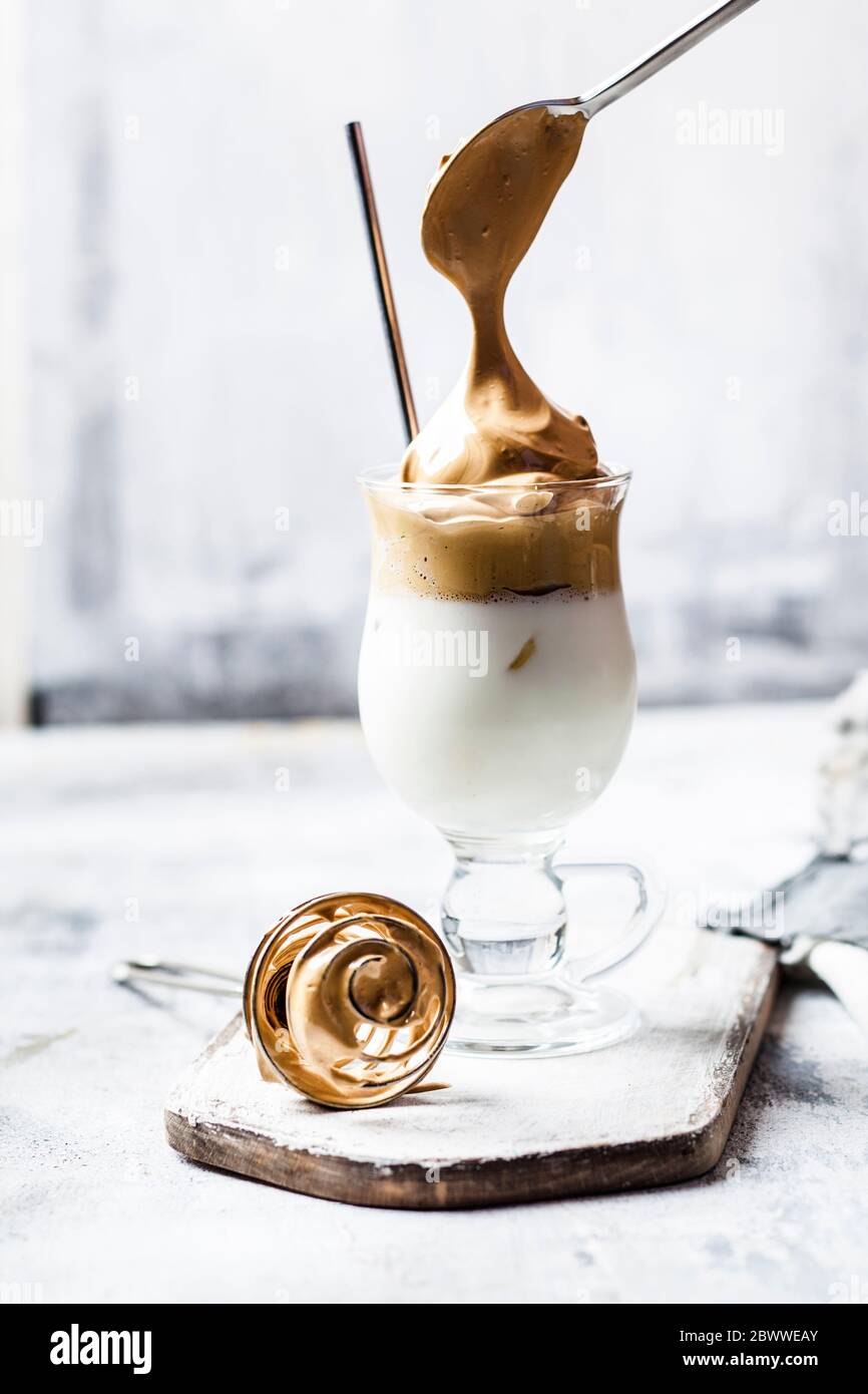 Cup of dalgona coffee with iced milk Stock Photo